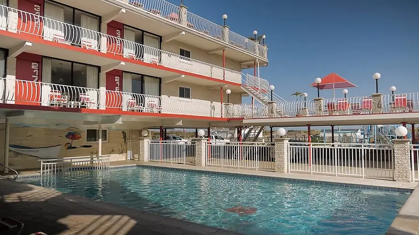 Wide view of the Matador Oceanfront Resort and its pool courtyard from the beach side