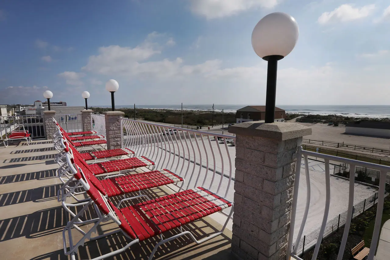 Seating and shade umbrellas on the fourth-floor oceanfront sundeck at the Matador