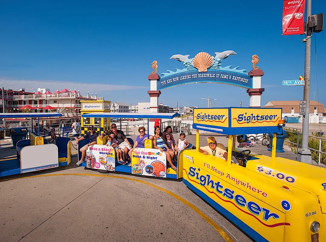 The Wildwoods boardwalk tram car passing in front of the Matador Oceanfront Resort