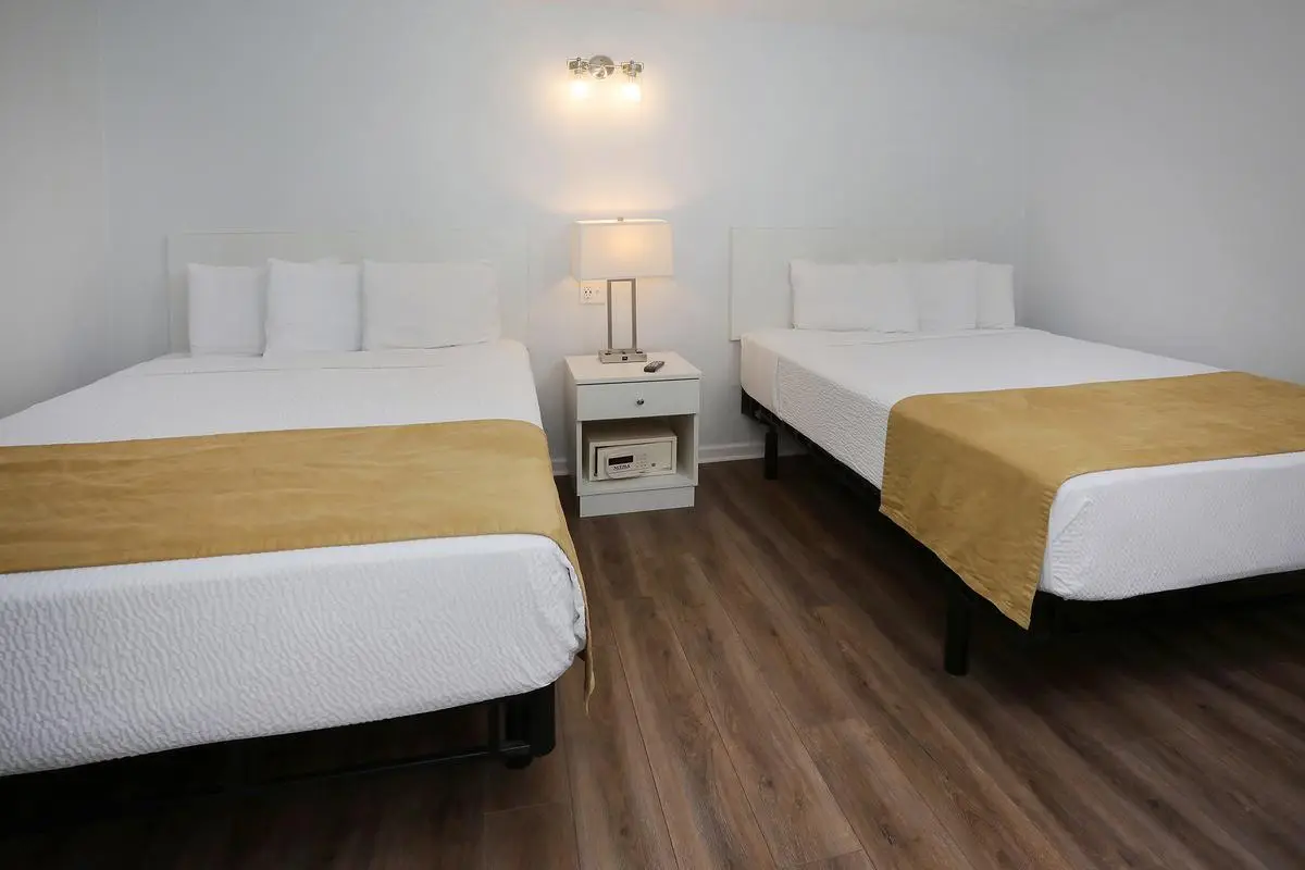Two queen beds in the bedroom of a Type 7 Ocean Front Beach Suite at the Matador